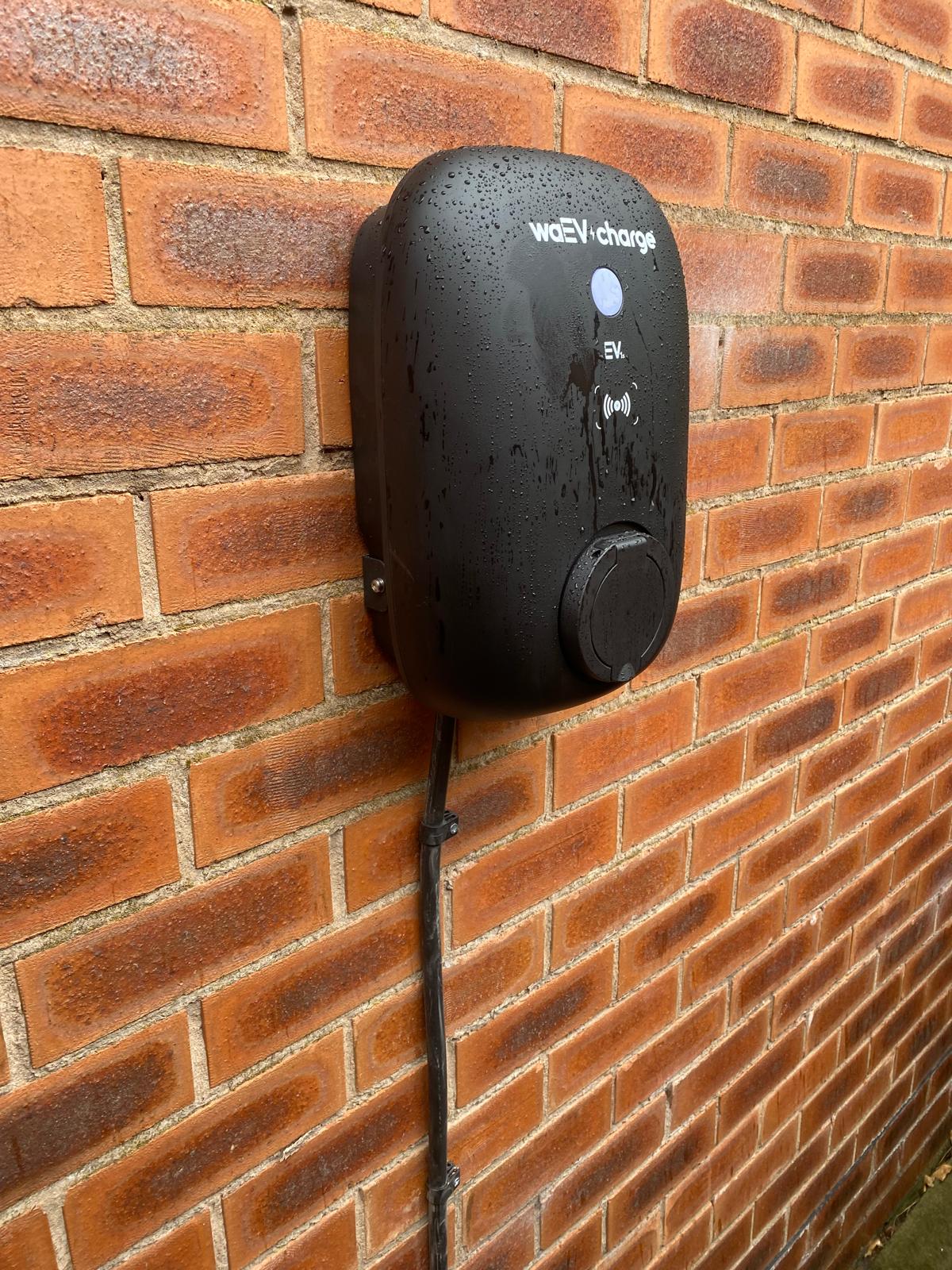 waEV wall-mounted EV charger installation on brick wall, Liverpool