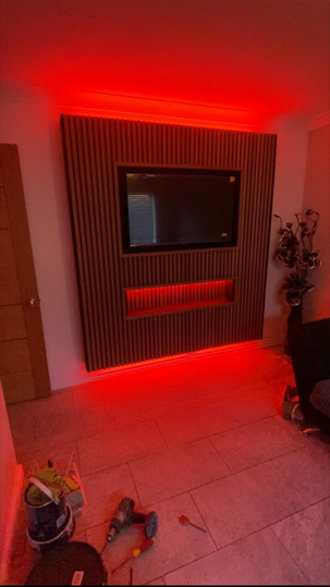 Domestic feature lighting behind a media wall with warm LED strip, Fox Electrical Liverpool